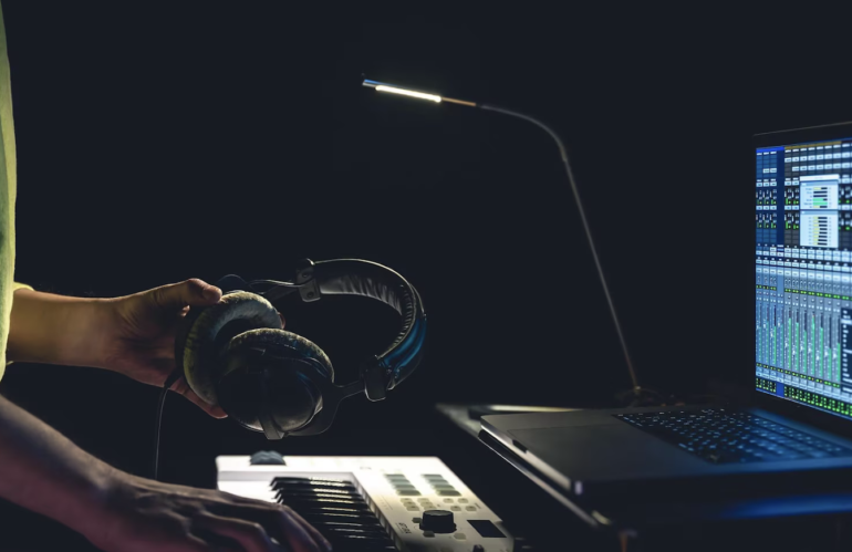 Musician holding headphones in his hands